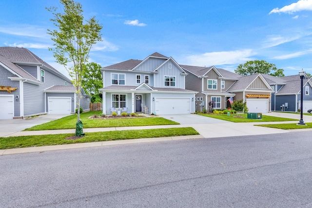 2110 Lequire Ln, Spring Hill, TN 37174 - view of front of property featuring board and batten siding, driveway, a residential view, and an attached garage