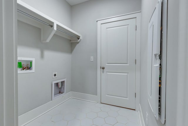2110 Lequire Ln, Spring Hill, TN 37174 - laundry area with hookup for a washing machine, electric dryer hookup, and light tile patterned floors