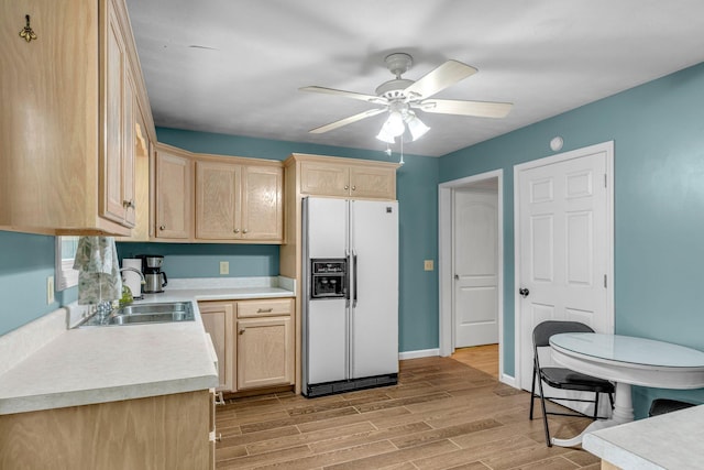 3316 Burr Rd, Springfield, TN 37172 - kitchen with white fridge with ice dispenser, light brown cabinetry, light countertops, and light wood-style floors