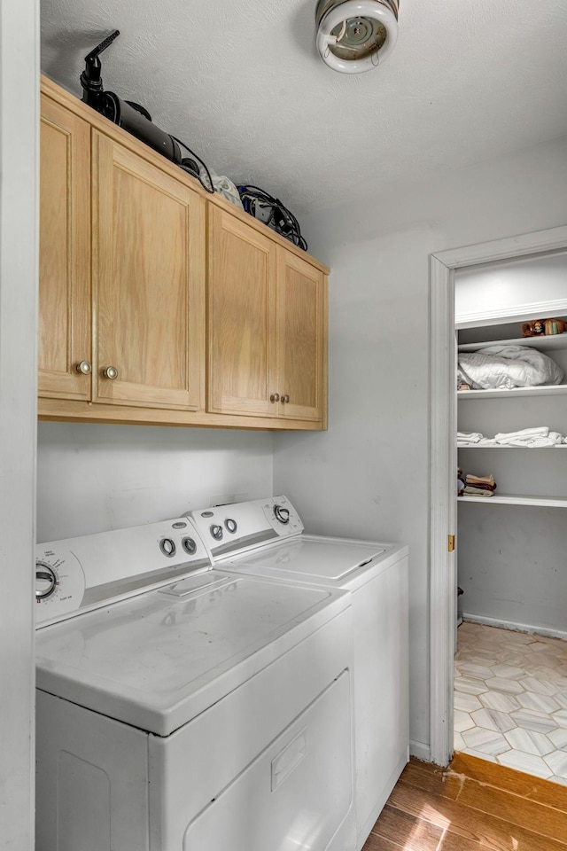 3316 Burr Rd, Springfield, TN 37172 - washroom featuring washer and dryer, cabinet space, and light wood-style flooring