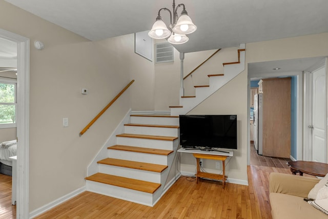 3316 Burr Rd, Springfield, TN 37172 - stairway featuring wood finished floors and a chandelier