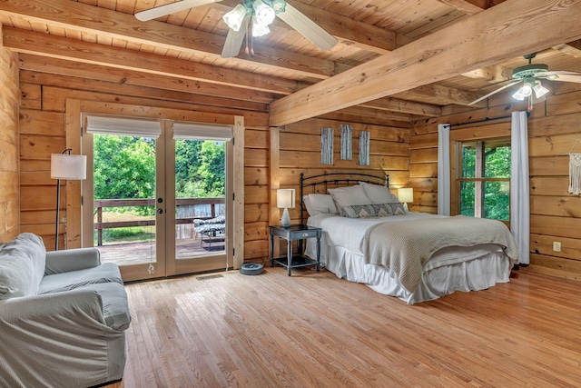 3316 Burr Rd, Springfield, TN 37172 - bedroom with multiple windows, access to outside, a wood ceiling with exposed beams, wood finished floors, and wooden walls
