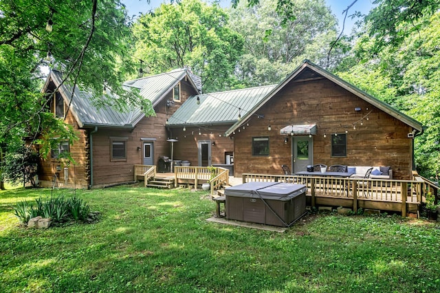 3316 Burr Rd, Springfield, TN 37172 - rear view of house featuring a hot tub, a lawn, a deck, and a metal roof