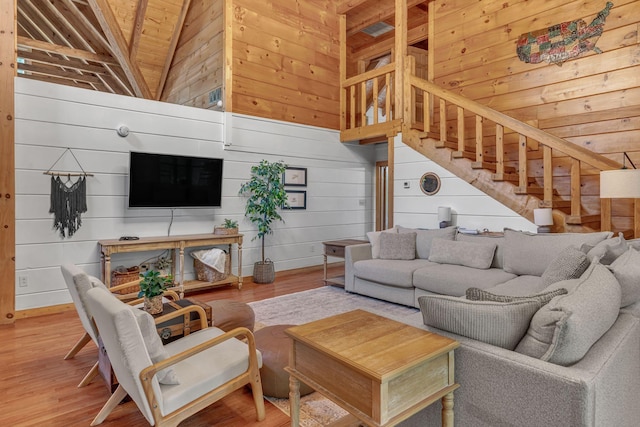 3316 Burr Rd, Springfield, TN 37172 - living area featuring wood walls, stairs, wood finished floors, and lofted ceiling