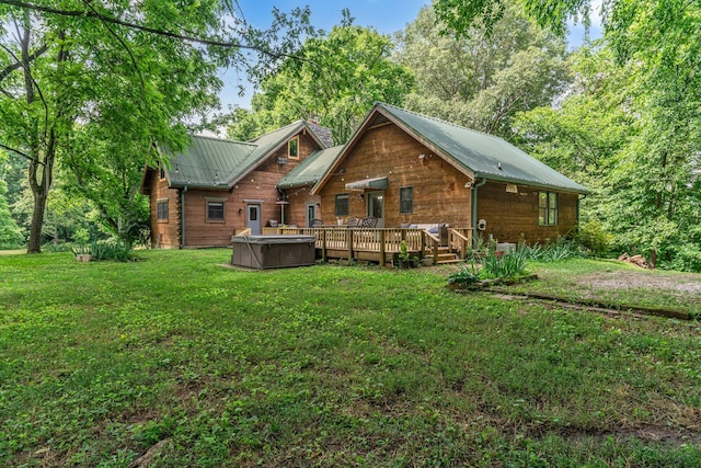 3316 Burr Rd, Springfield, TN 37172 - back of property featuring a hot tub, a lawn, a deck, and a metal roof