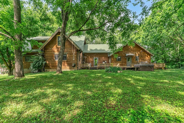 3316 Burr Rd, Springfield, TN 37172 - rear view of house with a deck, a lawn, and a metal roof