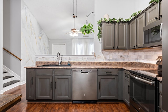 525 Scotts Creek Trl, Hermitage, TN 37076 - kitchen with appliances with stainless steel finishes, gray cabinetry, ceiling fan, dark wood finished floors, and backsplash