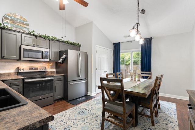 525 Scotts Creek Trl, Hermitage, TN 37076 - kitchen featuring stainless steel appliances, tasteful backsplash, gray cabinets, dark wood-style flooring, and high vaulted ceiling