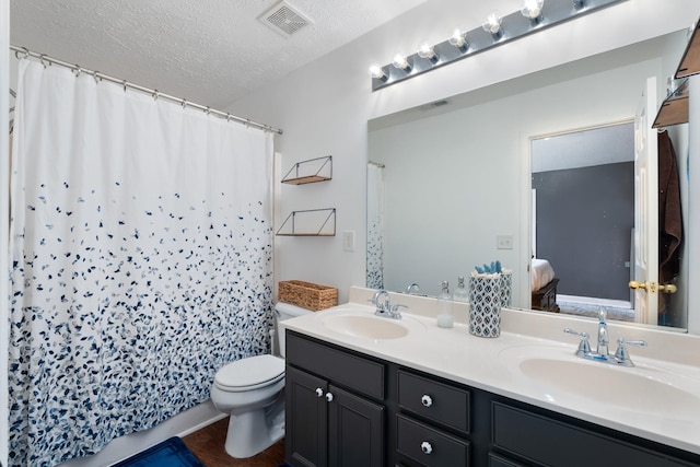525 Scotts Creek Trl, Hermitage, TN 37076 - bathroom with ensuite bathroom, double vanity, a textured ceiling, a shower with shower curtain, and wood finished floors