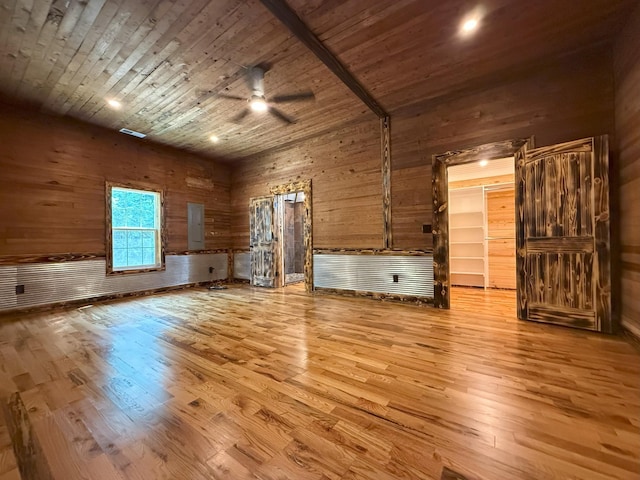 175 State Route 22a S, Jacks Creek, TN 38347 - unfurnished living room with a ceiling fan, wood finished floors, wood walls, wood ceiling, and a high ceiling