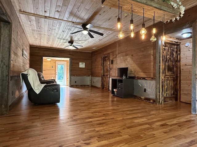 175 State Route 22a S, Jacks Creek, TN 38347 - unfurnished living room with wood finished floors, wood ceiling, wood walls, and a ceiling fan