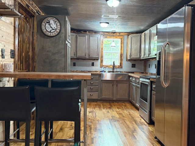 175 State Route 22a S, Jacks Creek, TN 38347 - kitchen featuring stainless steel appliances and light wood-style flooring
