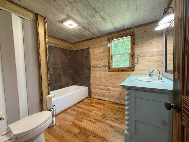 175 State Route 22a S, Jacks Creek, TN 38347 - bathroom with vanity, a tub to relax in, wood finished floors, and wood walls