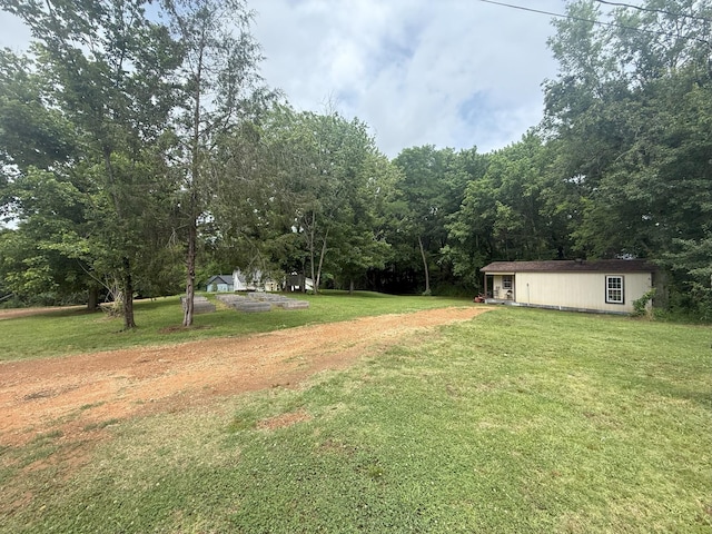 175 State Route 22a S, Jacks Creek, TN 38347 - view of green lawn with an outbuilding