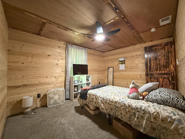 175 State Route 22a S, Jacks Creek, TN 38347 - bedroom featuring wooden walls, carpet, and a ceiling fan