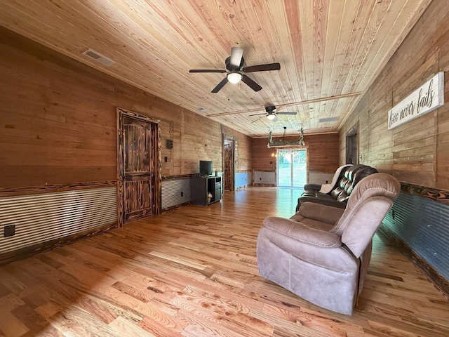 175 State Route 22a S, Jacks Creek, TN 38347 - sitting room featuring wood ceiling, wood finished floors, wooden walls, and a ceiling fan