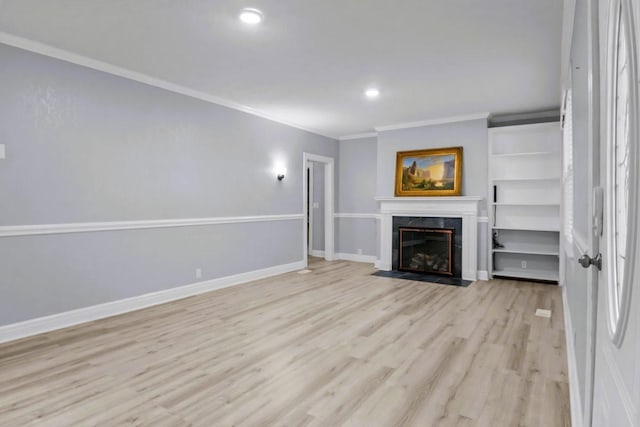 119 N Forrest Ave, Camden, TN 38320 - unfurnished living room featuring crown molding, light wood-type flooring, a fireplace, and recessed lighting