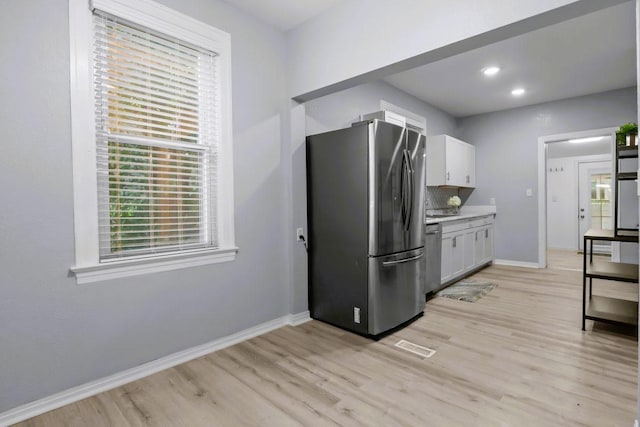 119 N Forrest Ave, Camden, TN 38320 - kitchen with appliances with stainless steel finishes, light wood-style flooring, white cabinetry, light countertops, and recessed lighting
