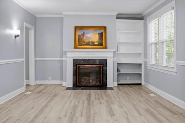 119 N Forrest Ave, Camden, TN 38320 - unfurnished living room featuring wood finished floors, crown molding, and a high end fireplace