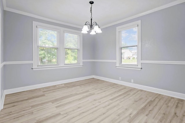 119 N Forrest Ave, Camden, TN 38320 - spare room with ornamental molding, a chandelier, and light wood finished floors