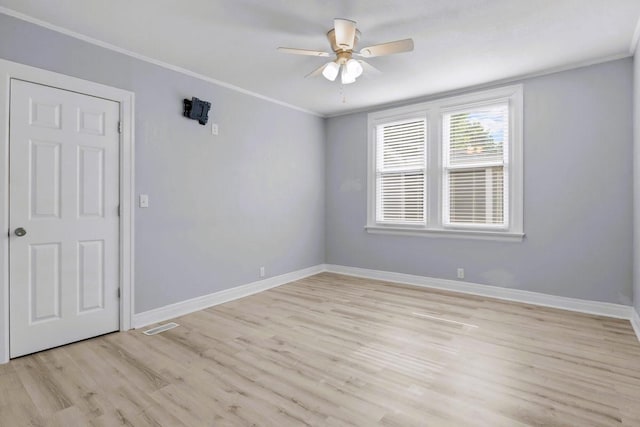 119 N Forrest Ave, Camden, TN 38320 - empty room with ceiling fan, light wood-style floors, and ornamental molding
