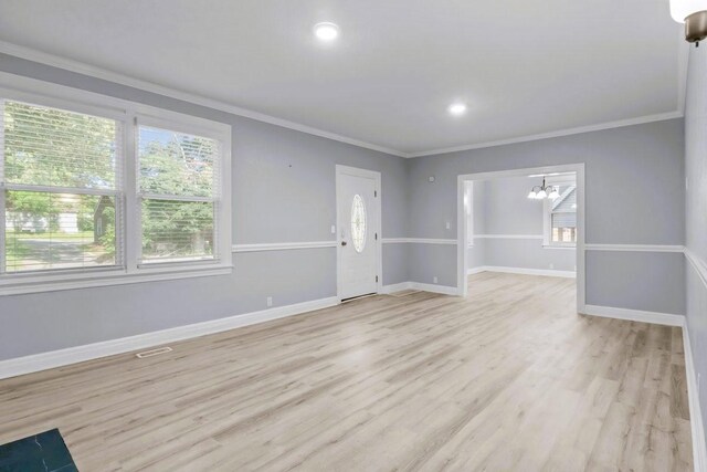 119 N Forrest Ave, Camden, TN 38320 - unfurnished living room featuring ornamental molding, a chandelier, light wood finished floors, and recessed lighting