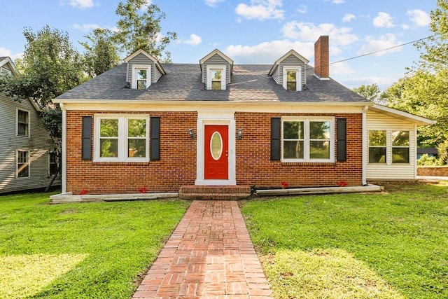 119 N Forrest Ave, Camden, TN 38320 - cape cod home with brick siding and a front lawn
