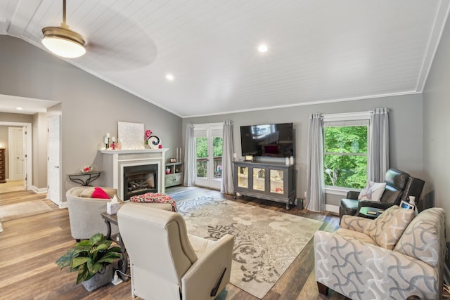 1001 Red Oak Dr, Greenbrier, TN 37073 - living area with vaulted ceiling, wood finished floors, a fireplace, ornamental molding, and recessed lighting
