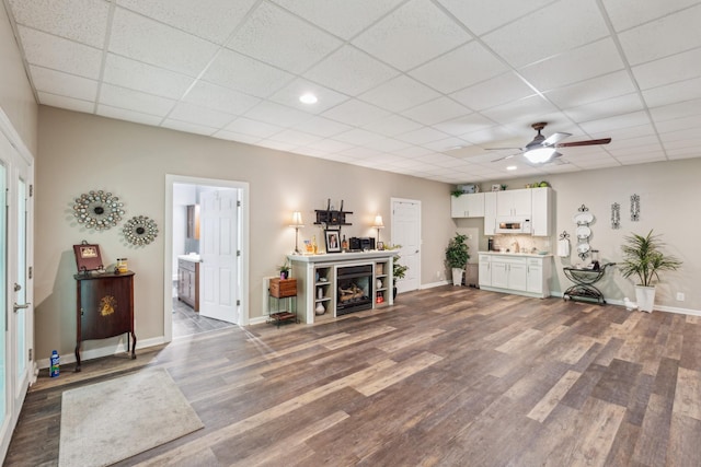 1001 Red Oak Dr, Greenbrier, TN 37073 - living room with dark wood-type flooring, a drop ceiling, ceiling fan, and recessed lighting
