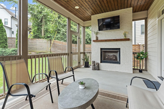 1931 Warfield Dr, Nashville, TN 37215 - sunroom with an outdoor brick fireplace and healthy amount of natural light