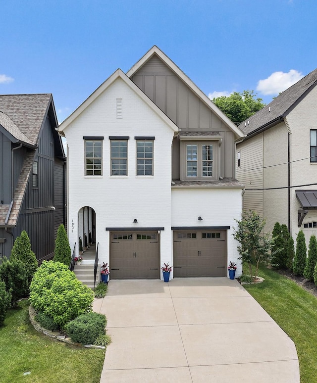 1931 Warfield Dr, Nashville, TN 37215 - view of front facade with a garage, board and batten siding, and concrete driveway