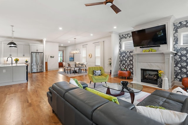 1931 Warfield Dr, Nashville, TN 37215 - living area featuring light wood-type flooring, a fireplace, ceiling fan, and recessed lighting