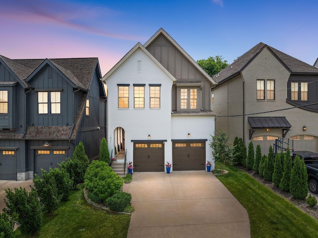 1931 Warfield Dr, Nashville, TN 37215 - view of front of home featuring board and batten siding, an attached garage, driveway, and a front yard