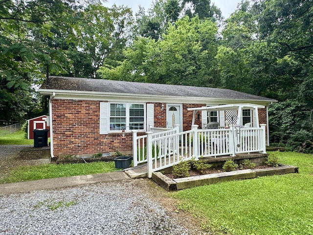 106 Hogin Rd, Dickson, TN 37055 - ranch-style home with brick siding and a front yard