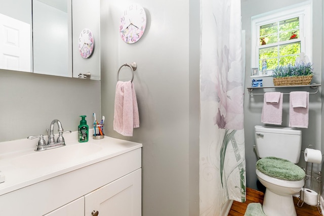 106 Hogin Rd, Dickson, TN 37055 - full bath with vanity, wood finished floors, and a shower with curtain