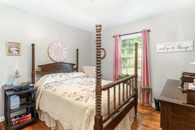 106 Hogin Rd, Dickson, TN 37055 - bedroom with wood finished floors and baseboards