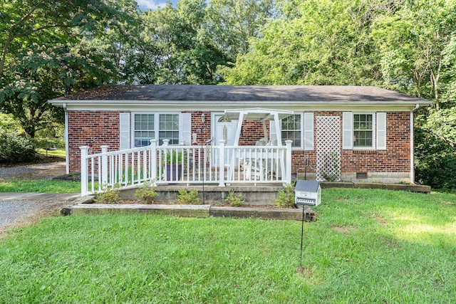 106 Hogin Rd, Dickson, TN 37055 - ranch-style home featuring crawl space, brick siding, covered porch, and a front lawn