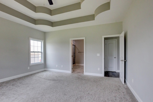 1331 Juniper Pass, Clarksville, TN 37043 - unfurnished bedroom featuring carpet flooring, a raised ceiling, and ceiling fan
