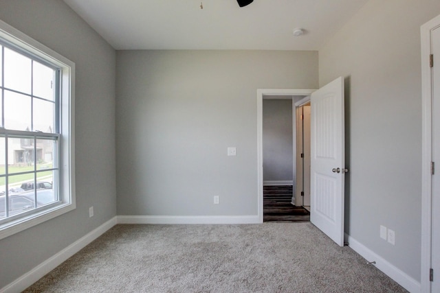 1331 Juniper Pass, Clarksville, TN 37043 - unfurnished bedroom featuring multiple windows, carpet flooring, and ceiling fan