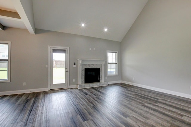 1331 Juniper Pass, Clarksville, TN 37043 - unfurnished living room featuring dark wood-type flooring, high vaulted ceiling, a fireplace, recessed lighting, and beam ceiling
