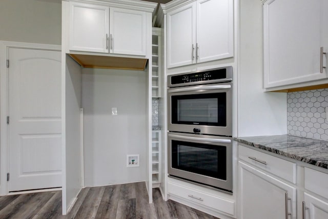 1331 Juniper Pass, Clarksville, TN 37043 - kitchen featuring double oven, white cabinetry, light stone countertops, dark wood-style floors, and backsplash