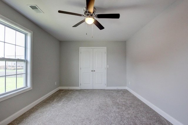 1331 Juniper Pass, Clarksville, TN 37043 - unfurnished bedroom with multiple windows, carpet, a closet, and a ceiling fan