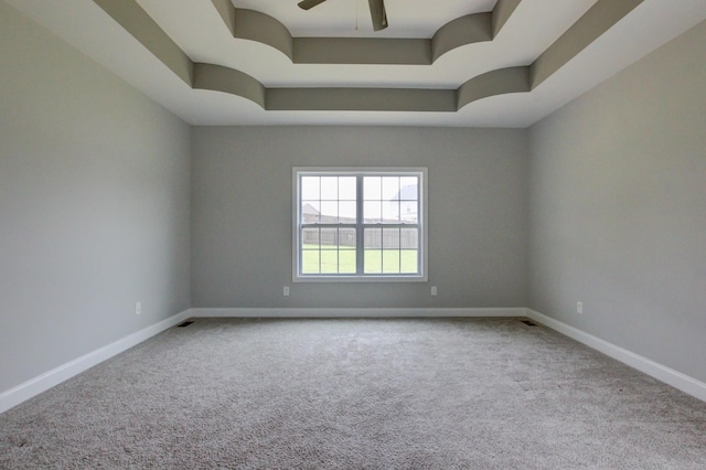 1331 Juniper Pass, Clarksville, TN 37043 - spare room featuring a tray ceiling, carpet floors, and a ceiling fan