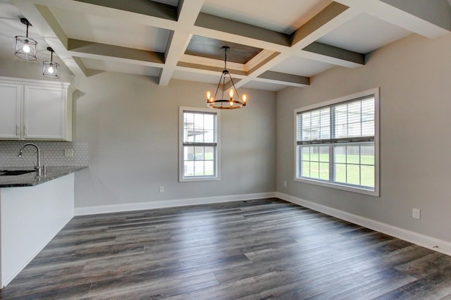 1331 Juniper Pass, Clarksville, TN 37043 - unfurnished dining area featuring healthy amount of natural light, a chandelier, dark wood-style floors, beamed ceiling, and coffered ceiling