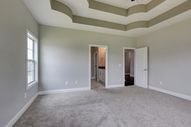 1331 Juniper Pass, Clarksville, TN 37043 - unfurnished bedroom featuring multiple windows, light carpet, and ensuite bathroom