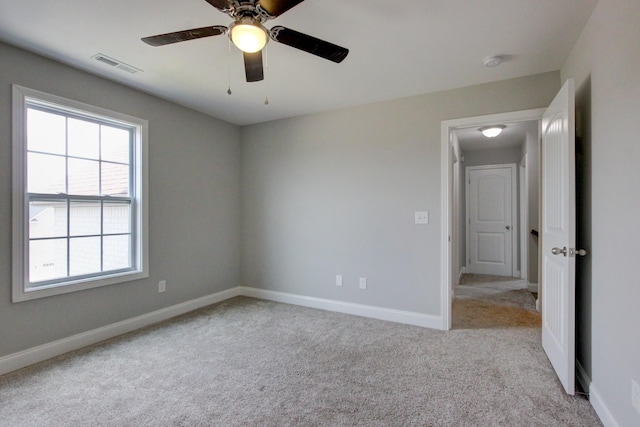1331 Juniper Pass, Clarksville, TN 37043 - empty room featuring carpet flooring, plenty of natural light, a smoke detector, and ceiling fan