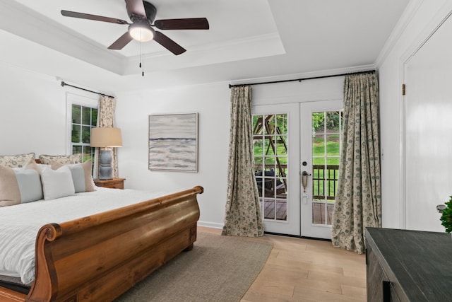 5191 Still House Hollow Rd, Franklin, TN 37064 - bedroom with french doors, access to outside, a tray ceiling, multiple windows, and crown molding