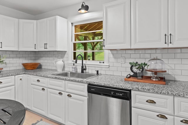 5191 Still House Hollow Rd, Franklin, TN 37064 - kitchen with dishwasher, white cabinetry, backsplash, and light stone countertops