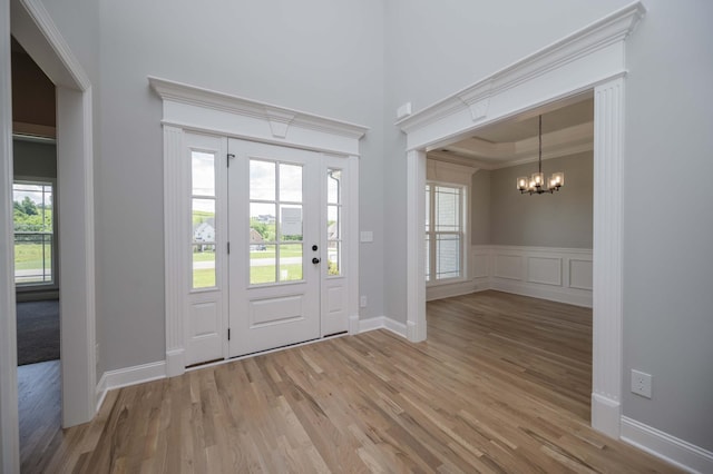 135 Bruce Meadows Dr, Beechgrove, TN 37018 - entryway featuring a chandelier, light wood-type flooring, plenty of natural light, and crown molding