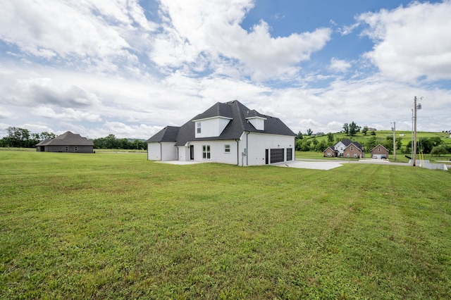 135 Bruce Meadows Dr, Beechgrove, TN 37018 - rear view of house featuring concrete driveway, a yard, and a shingled roof